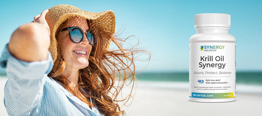 Woman enjoying summer sun on beach with Krill Oil Synergy supplement for skin health support
